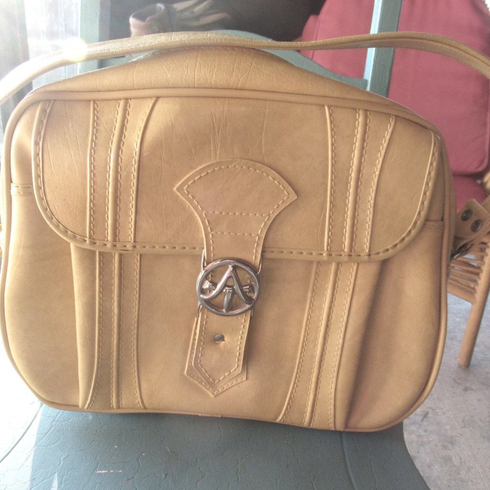Gold Escort Bag by American Tourister Luggage Works